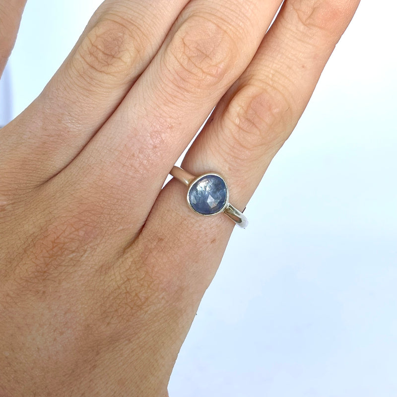 sterling silver ring set with a blue purple tanzanite. 